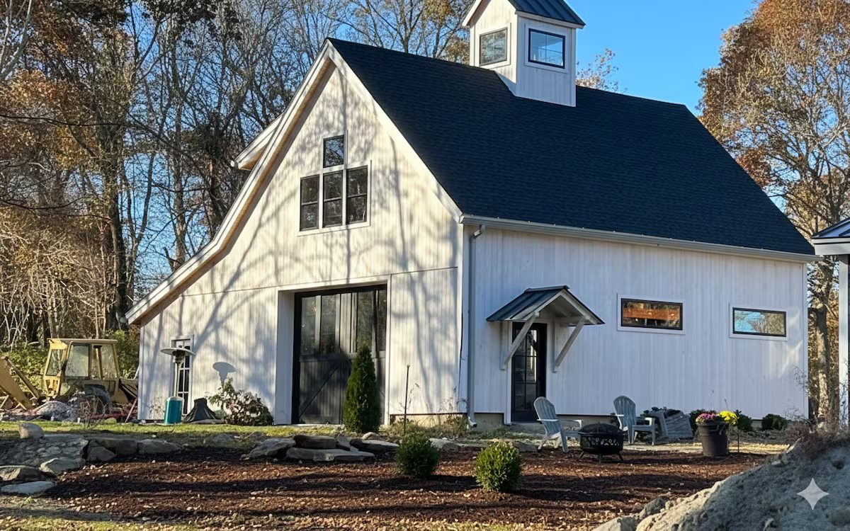 The farmhouse and barn at dusk